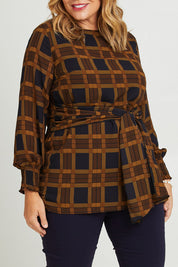 Model Fiona wearing size 16 of The Printed Chiffon Lined Tunic in colour Checks (Blue), from the front, cropped image