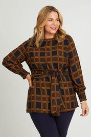 Model Fiona wearing size 16 of The Printed Chiffon Lined Tunic in colour Checks (Blue), from the front, cropped image