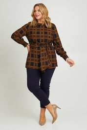 Model Fiona wearing size 16 of The Printed Chiffon Lined Tunic in colour Checks (Blue), from the front, showing the whole outfit