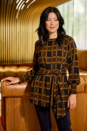 Model Miranda wearing size 10 of The Printed Chiffon Lined Tunic in colour Checks (Blue), from the front, showing the whole outfit