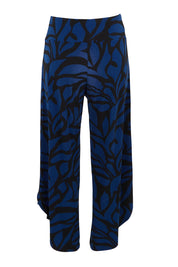 Product shot of The Printed Cross Over Pant in colour Bluevines (Blue), from the back
