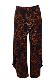 Product shot of The Printed Cross Over Pant in colour Navyfloral (Blue), from the front
