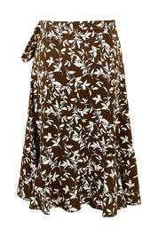 Product shot of The Lined Faux Wrap Ruffle Skirt in colour Vines, from the back