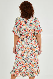 Model Maddy wearing size 16 of The Lined Kimono Sleeve Ruffle Hem Dress in colour Orchard, from the back