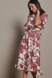 Model Amanda wearing size 10 of The Lined Kimono Sleeve Ruffle Hem Dress in colour Winebloom (Red), from the front, cropped image