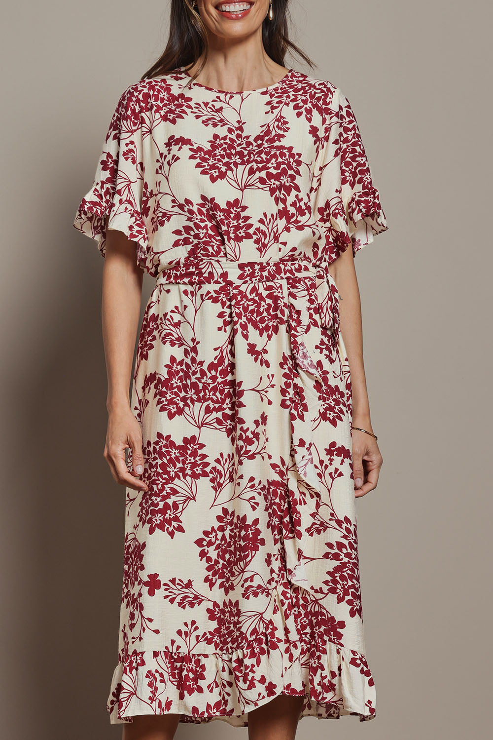 Model Amanda wearing size 10 of The Lined Kimono Sleeve Ruffle Hem Dress in colour Winebloom (Red), from the front, cropped image
