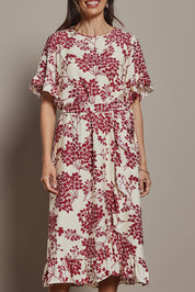Model Amanda wearing size 10 of The Lined Kimono Sleeve Ruffle Hem Dress in colour Winebloom (Red), from the front, cropped image