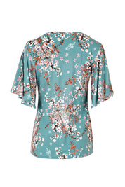 Product shot of The Butterfly Sleeve Top in colour Fiori (Blue), from the back