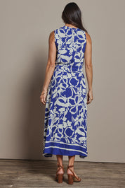 Model Amanda wearing size 10 of The Printed Adore Dress in colour Bluefloral (Blue), from the back