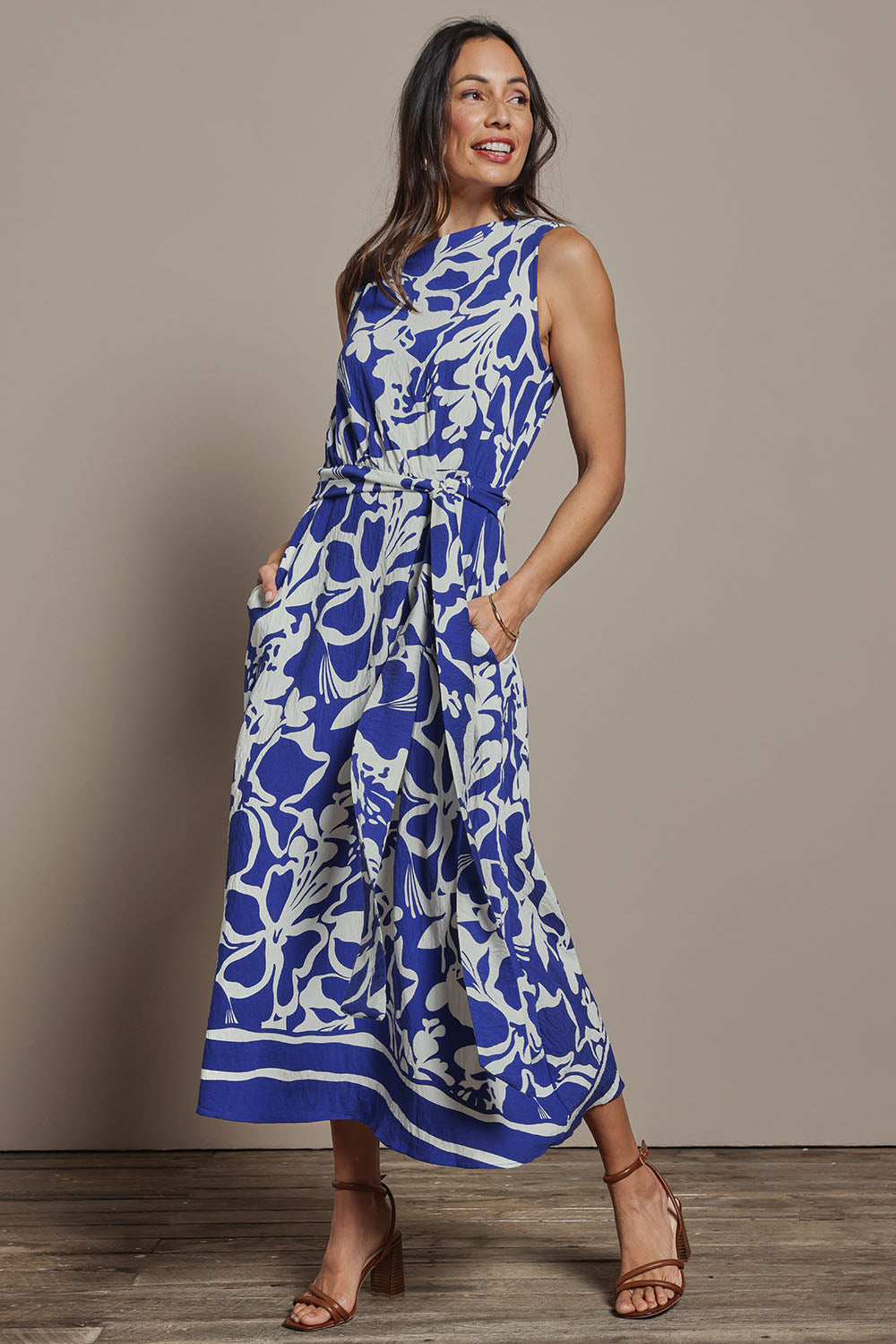 Model Amanda wearing size 10 of The Printed Adore Dress in colour Bluefloral (Blue), from the front, showing the whole outfit