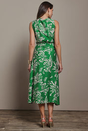 Model Madeline wearing size 10 of The Printed Adore Dress in colour Greenfleur (Green), from the back