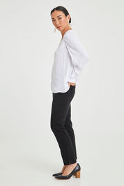 Model Katie wearing size 10 of The 7/8 Pocket Pull On Pant in colour Black (Black), from the front, showing the whole outfit