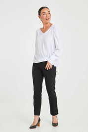 Model Katie wearing size 10 of The 7/8 Pocket Pull On Pant in colour Black (Black), from the front, showing the whole outfit