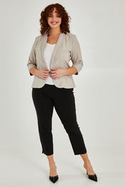 Model Maddy wearing size 16 of The 7/8 Pocket Pull On Pant in colour Black (Black), from the front, showing the whole outfit