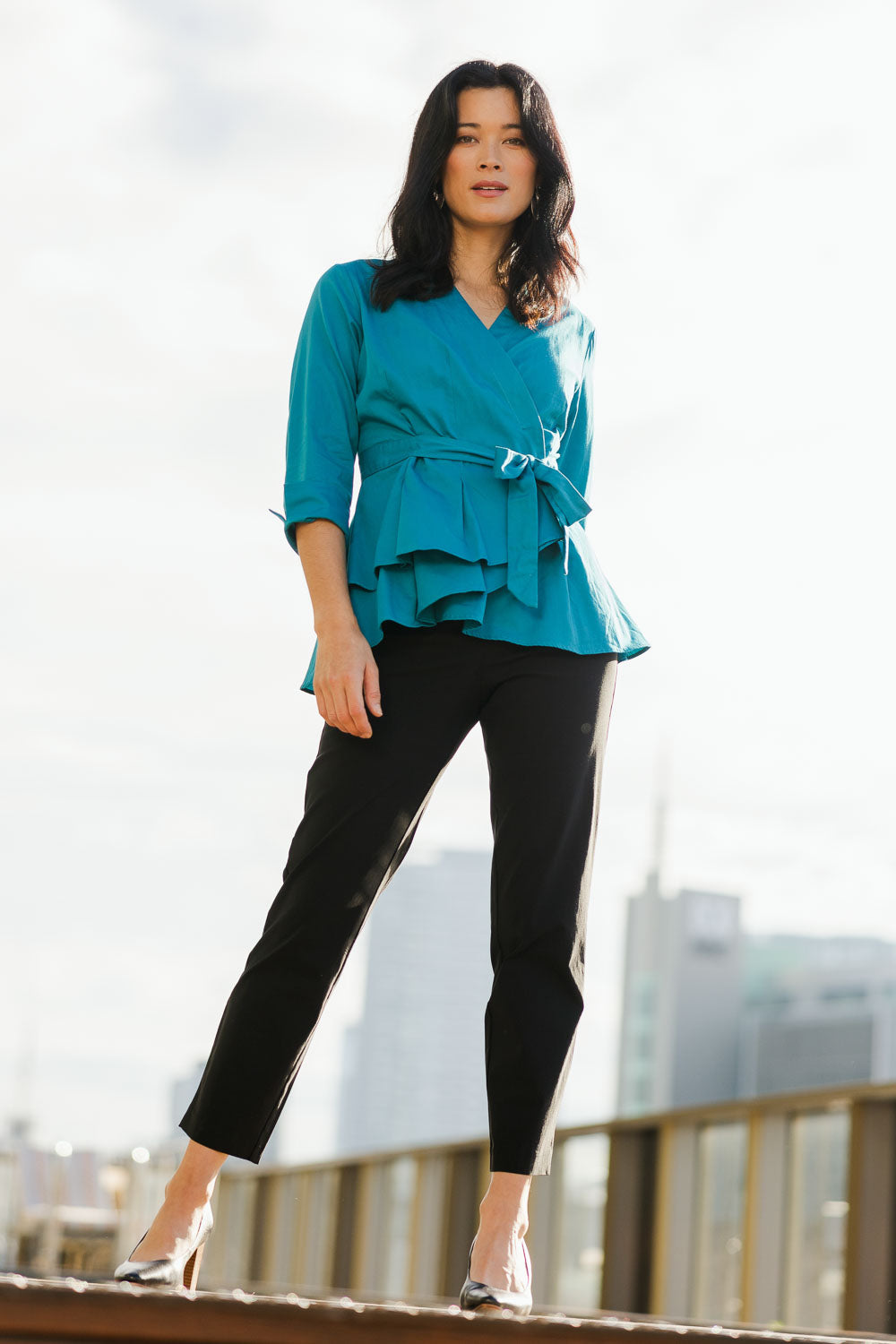 Model Miranda wearing size 10 of The 7/8 Pocket Pull On Pant in colour Black (Black), from the front, showing the whole outfit