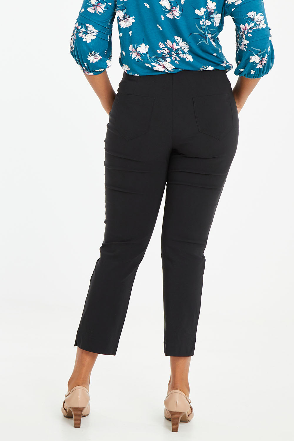 Model Noli wearing size 14 of The 7/8 Pocket Pull On Pant in colour Black (Black), from the back
