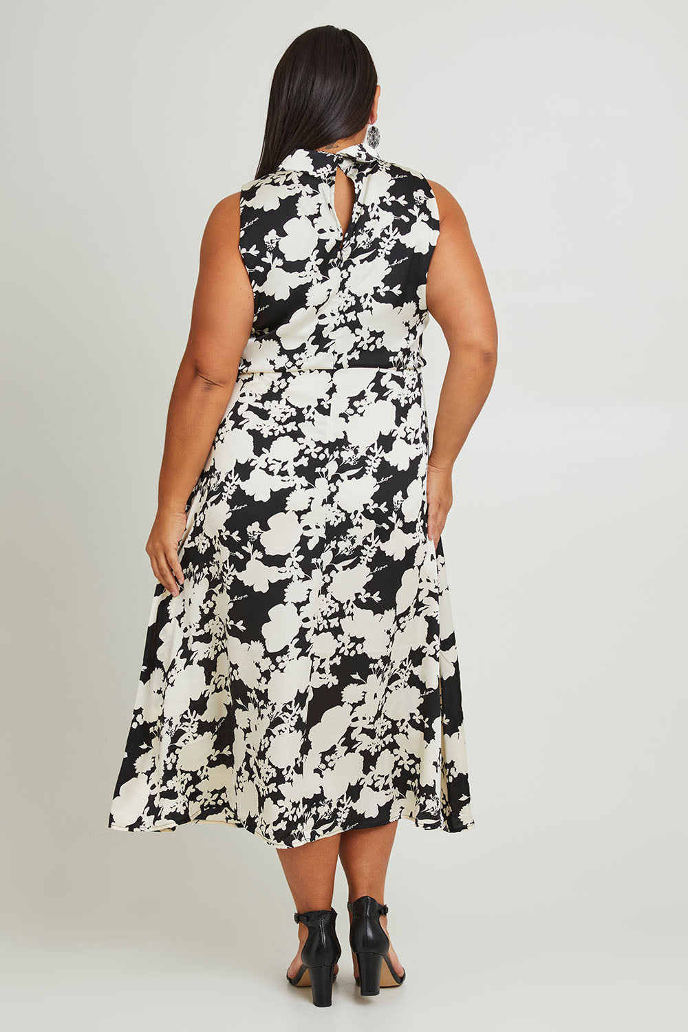 Model Ashleigh wearing size 16 of The Printed Roll Neck Dress in colour Blkblossom (Black), from the back
