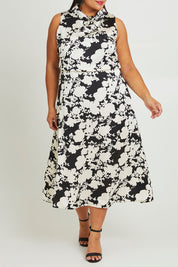 Model Ashleigh wearing size 16 of The Printed Roll Neck Dress in colour Blkblossom (Black), from the front, cropped image