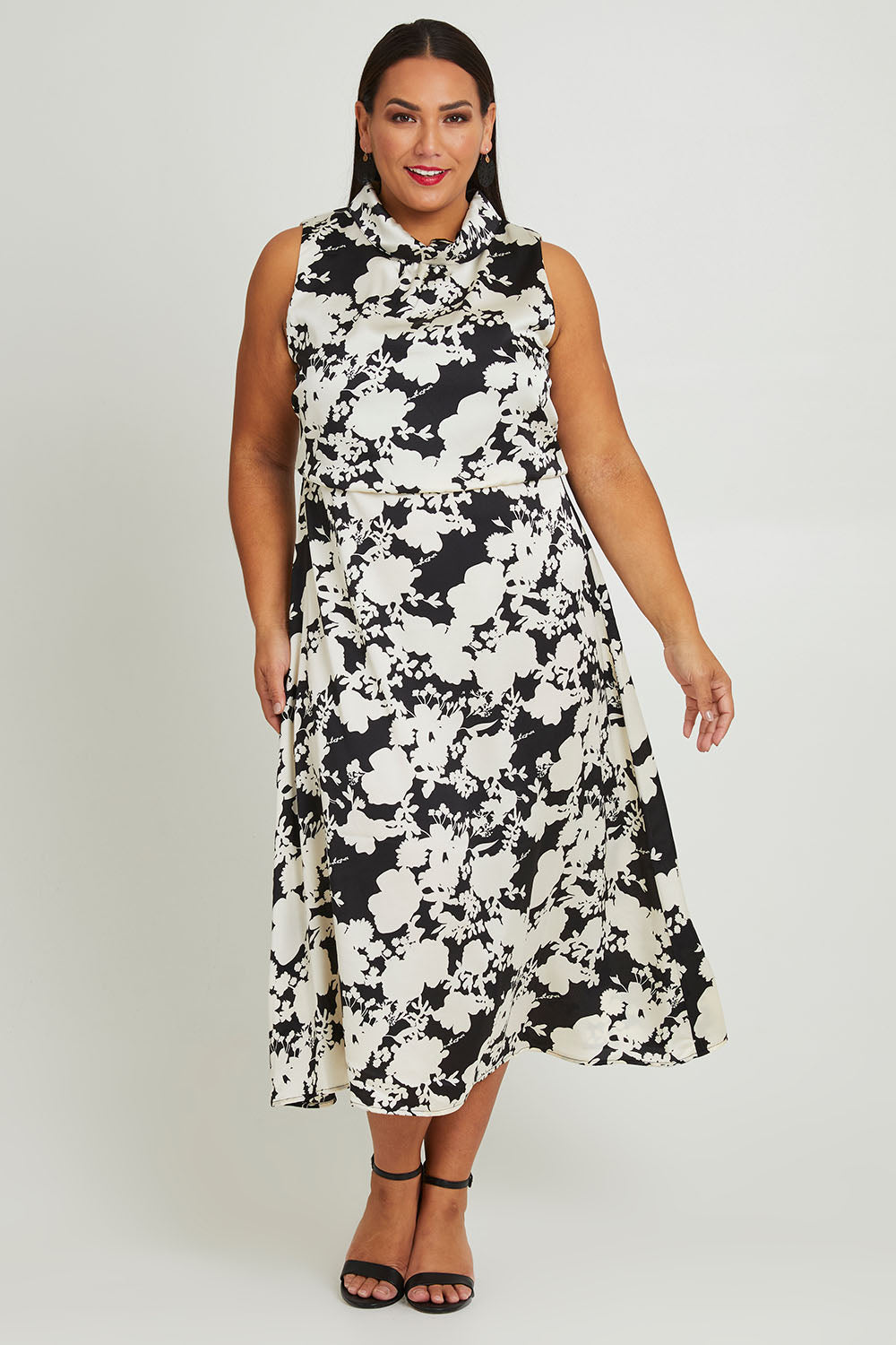 Model Ashleigh wearing size 16 of The Printed Roll Neck Dress in colour Blkblossom (Black), from the front, showing the whole outfit
