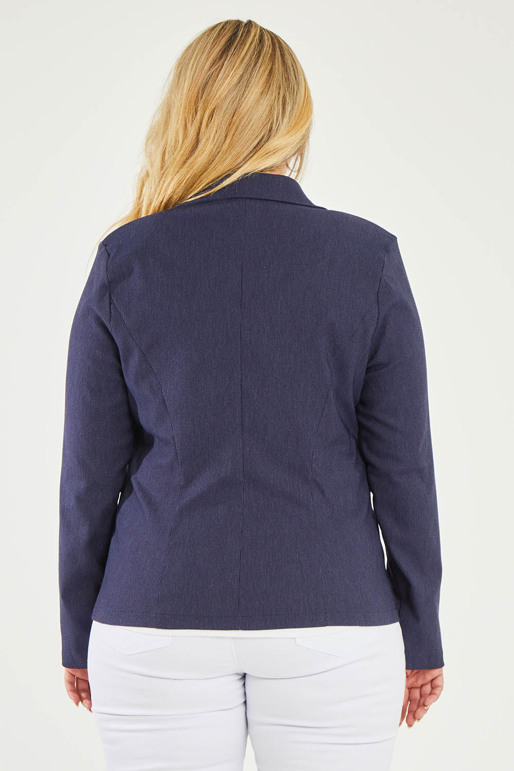 Model Katie wearing size 16 of The Stretch Classic Blazer in colour Navy (Blue), from the back