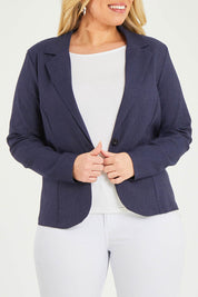 Model Katie wearing size 16 of The Stretch Classic Blazer in colour Navy (Blue), from the front, cropped image