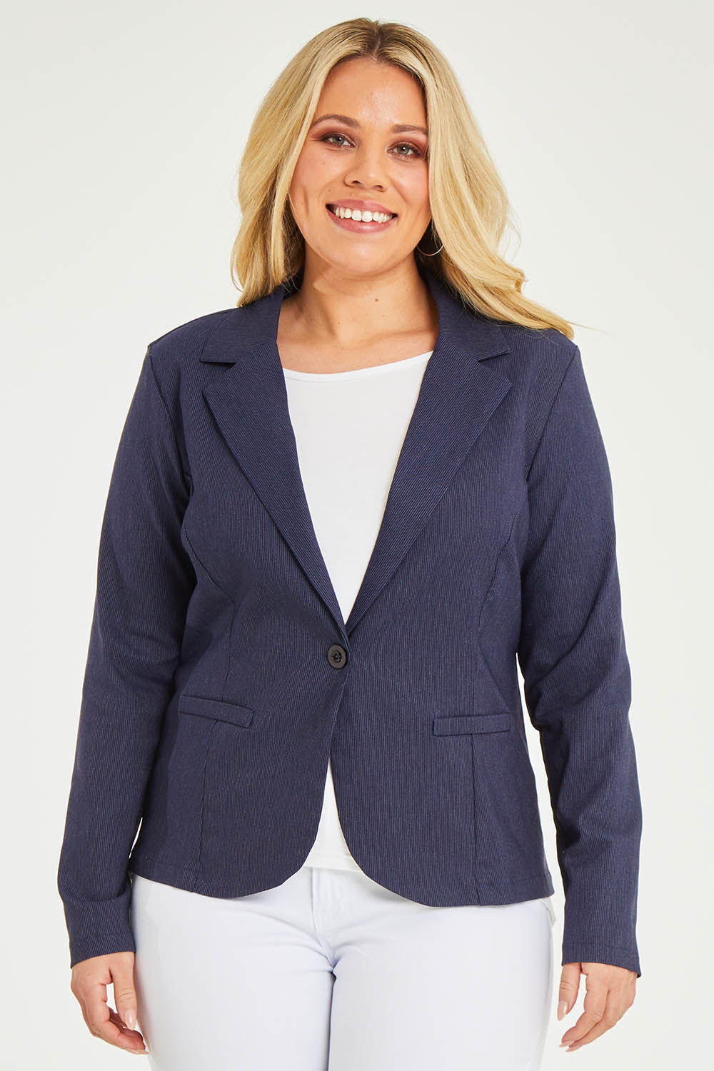 Model Katie wearing size 16 of The Stretch Classic Blazer in colour Navy (Blue), from the front, cropped image
