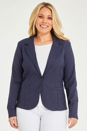 Model Katie wearing size 16 of The Stretch Classic Blazer in colour Navy (Blue), from the front, cropped image