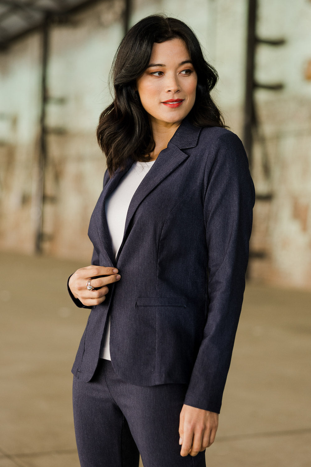 Model Miranda wearing size 10 of The Stretch Classic Blazer in colour Navy (Blue), from the front, showing the whole outfit