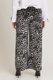 Model Chanel wearing size 16 of The Printed Velvet Pull On Pant in colour Leopard (Black), from the back