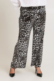 Model Chanel wearing size 16 of The Printed Velvet Pull On Pant in colour Leopard (Black), from the front, cropped image