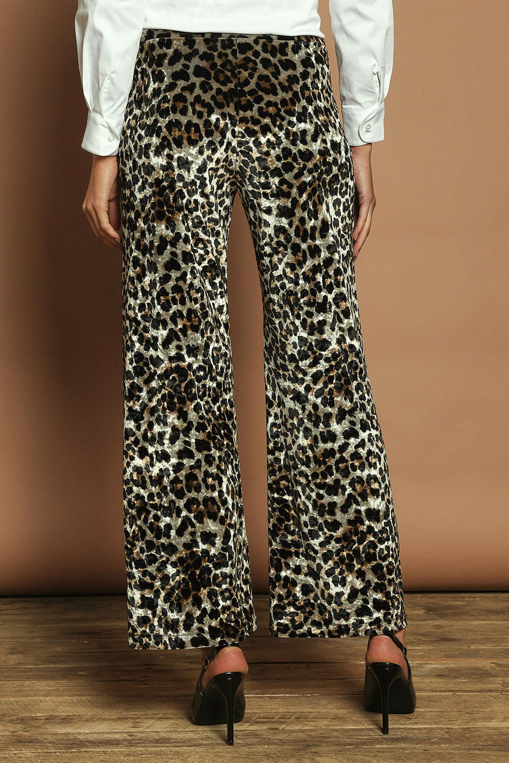 Model Madeline wearing size 10 of The Printed Velvet Pull On Pant in colour Leopard (Black), from the back