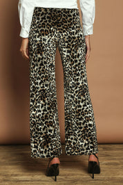 Model Madeline wearing size 10 of The Printed Velvet Pull On Pant in colour Leopard (Black), from the back
