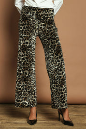 Model Madeline wearing size 10 of The Printed Velvet Pull On Pant in colour Leopard (Black), from the front, cropped image