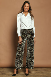 Model Madeline wearing size 10 of The Printed Velvet Pull On Pant in colour Leopard (Black), from the front, showing the whole outfit