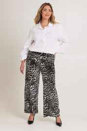 Model Tahnee wearing size 16 of The Printed Velvet Pull On Pant in colour Leopard (Black), from the front, showing the whole outfit