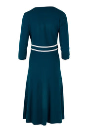Product shot of The Contrast Trim Knit Dress in colour Petrol (Blue), from the back