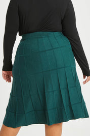 Model Alexis wearing size XL of The Midi Textured Knit Skirt in colour Tealgreen (Green), from the back