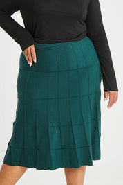 Model Alexis wearing size XL of The Midi Textured Knit Skirt in colour Tealgreen (Green), from the front, cropped image