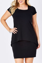 Model Jess wearing size 12 of The Short Sleeve Rita Dress in colour Black (Black), from the front, cropped image