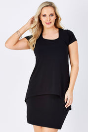 Model Jess wearing size 12 of The Short Sleeve Rita Dress in colour Black (Black), from the front, cropped image