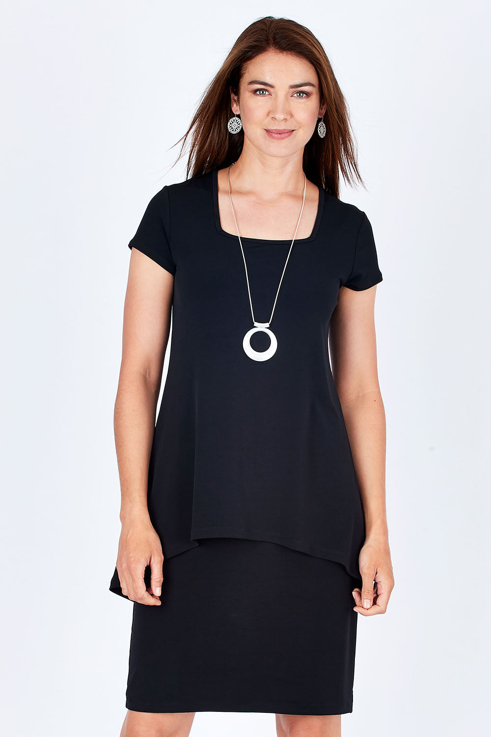 Model Rebecca wearing size 10 of The Short Sleeve Rita Dress in colour Black (Black), from the front, cropped image