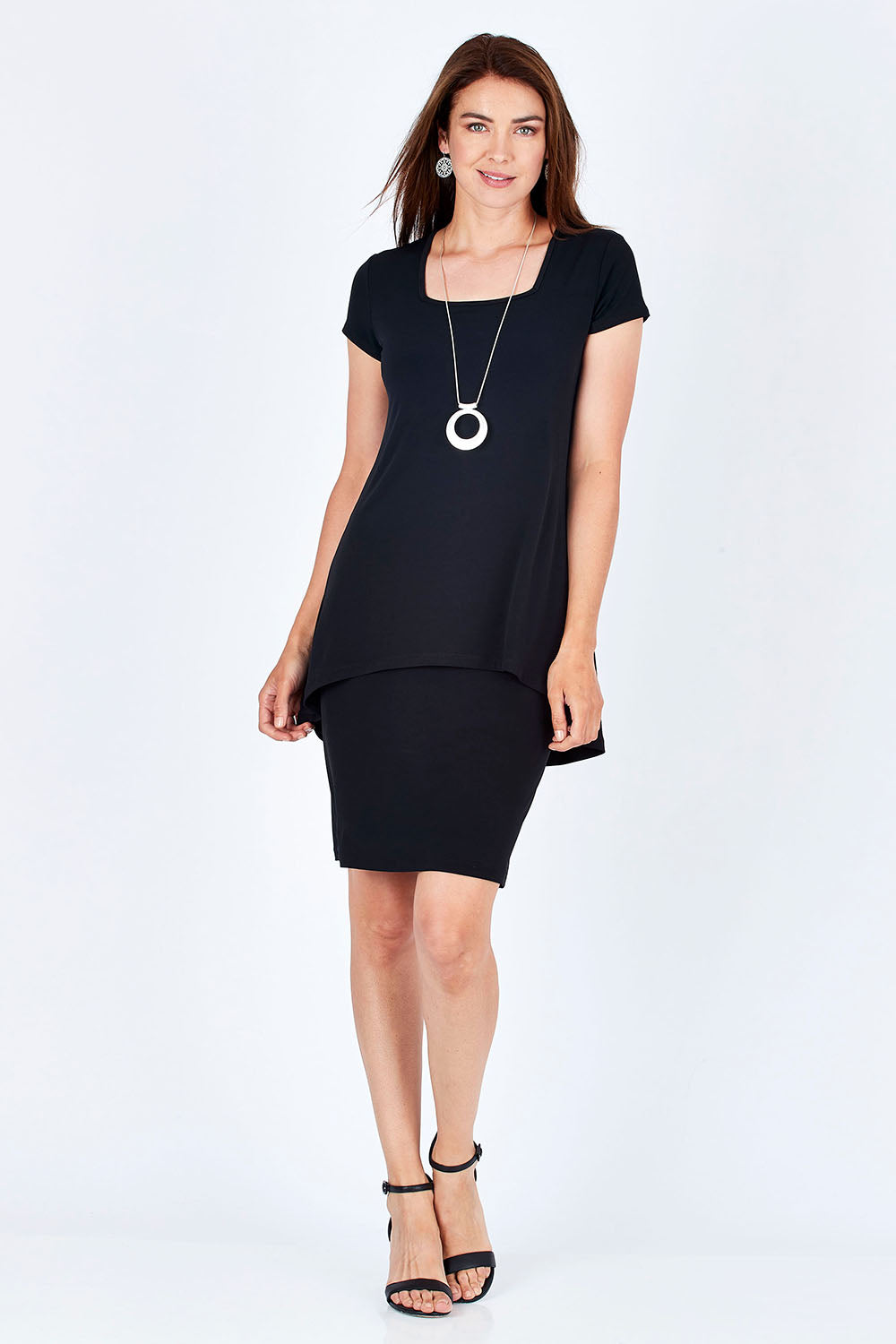 Model Rebecca wearing size 10 of The Short Sleeve Rita Dress in colour Black (Black), from the front, showing the whole outfit