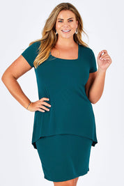 Model Fiona wearing size 16 of The Short Sleeve Rita Dress in colour DarkTeal (Green), from the front, cropped image