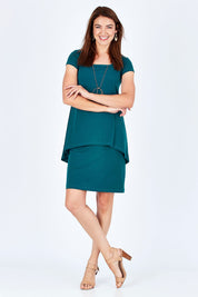 Model Rebecca wearing size 10 of The Short Sleeve Rita Dress in colour DarkTeal (Green), from the front, showing the whole outfit