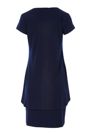 Product shot of The Short Sleeve Rita Dress in colour Navy (Blue), from the back