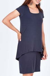 Model Rebecca wearing size 10 of The Short Sleeve Rita Dress in colour SmokeyGrey (Grey), from the front, cropped image