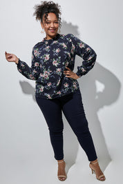 Model Alexis wearing size 16 of The Smocking Detail Printed Top in colour Flower (Blue), from the front, showing the whole outfit