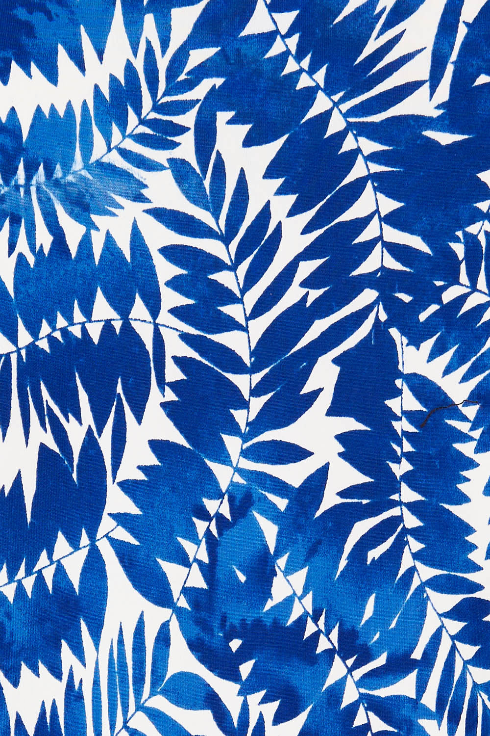 Product shot of The Printed Knot Waist Detail Blouse in colour Fern (Blue), detail