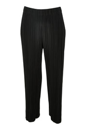 Product shot of The Timeless Plisse Travel Pant in colour Black (Black), from the front