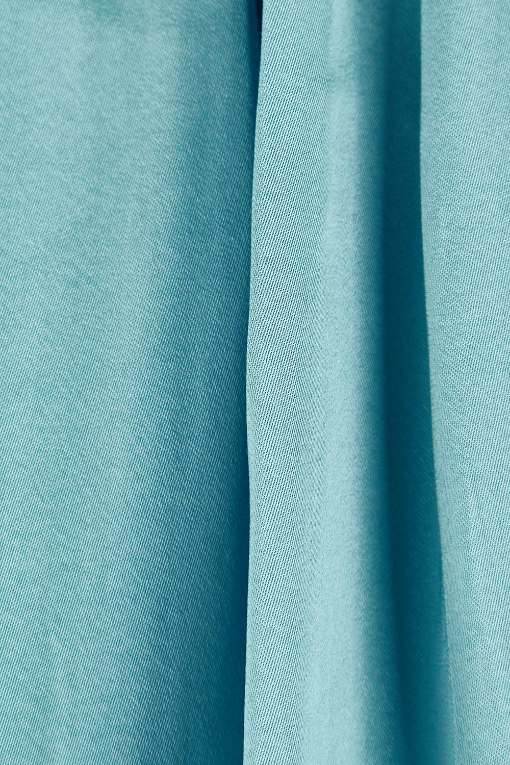 Product shot of The Luxe Tie Neck Blouse in colour Duckegg (Blue), detail